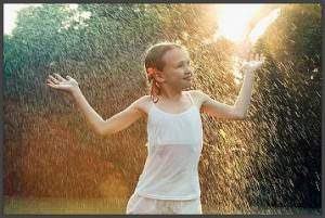 girl-enjoying-rain
