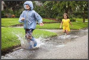 kids-playing-in-rain-water