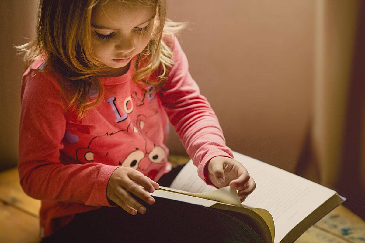Girl child reading book