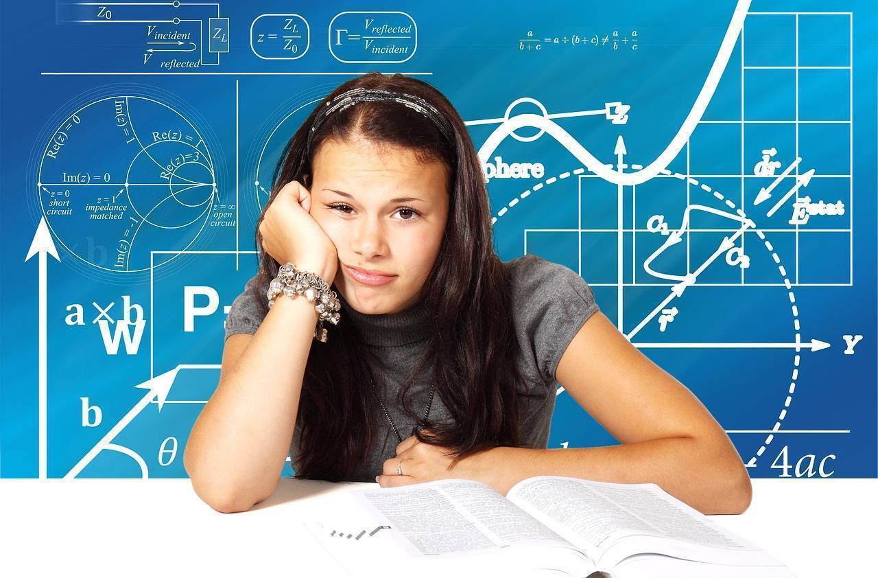 Sad looking teenage girl student studying