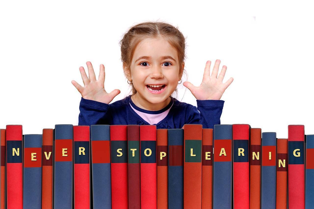 Smiling Girl with bunch of Books
