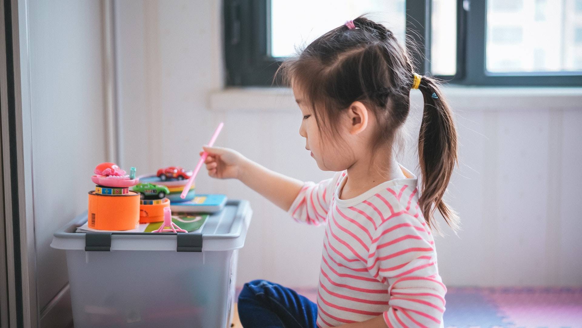 Girl Playing with Educational Toys