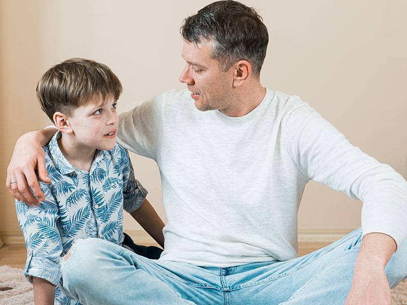 Father and son talking