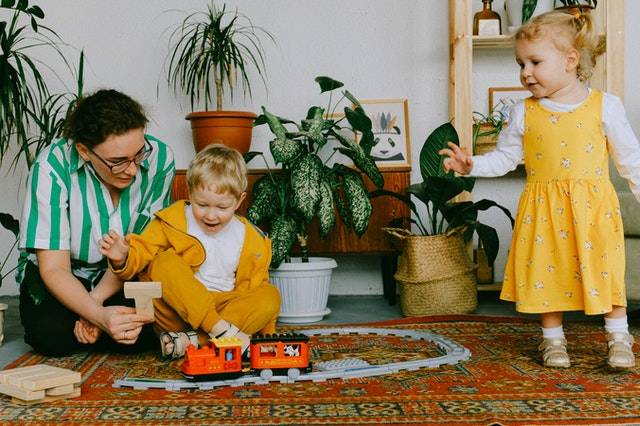 Kids and Parent Playing with Toys