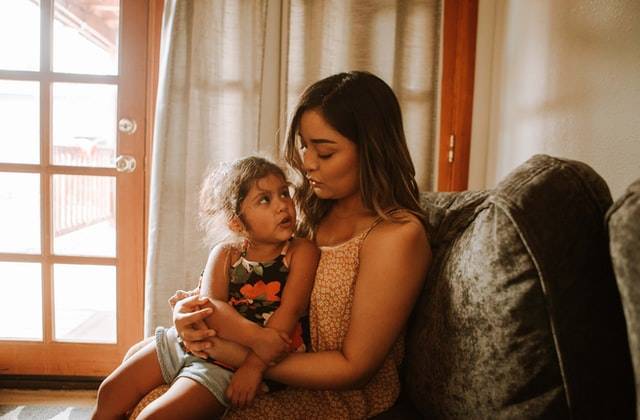 Mother talking to child