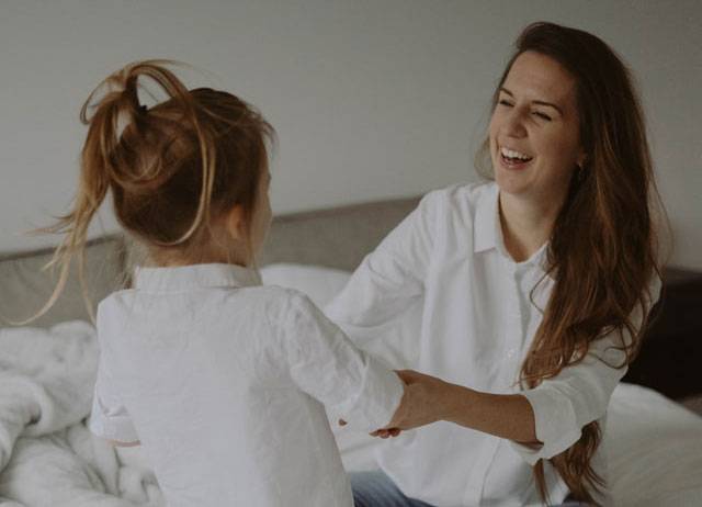Mother and Child Talking and Playing