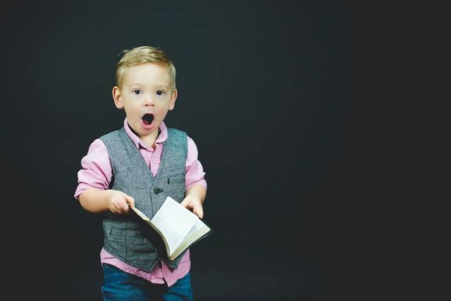 Young Boy Holding Book