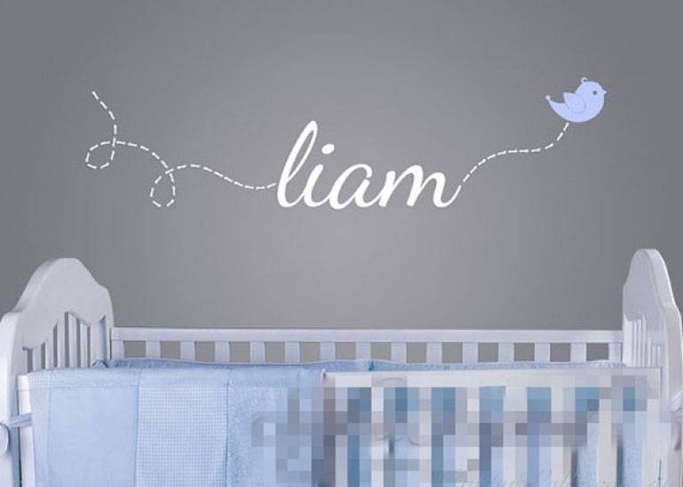 A picture containing text, baby bed, room, bedroom