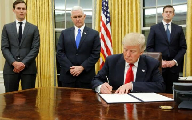 President Donald Trump signed his first executive order